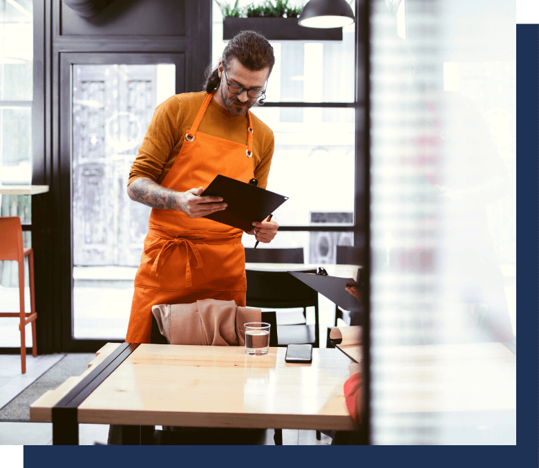 Restaurant employee looking at whitepaper information