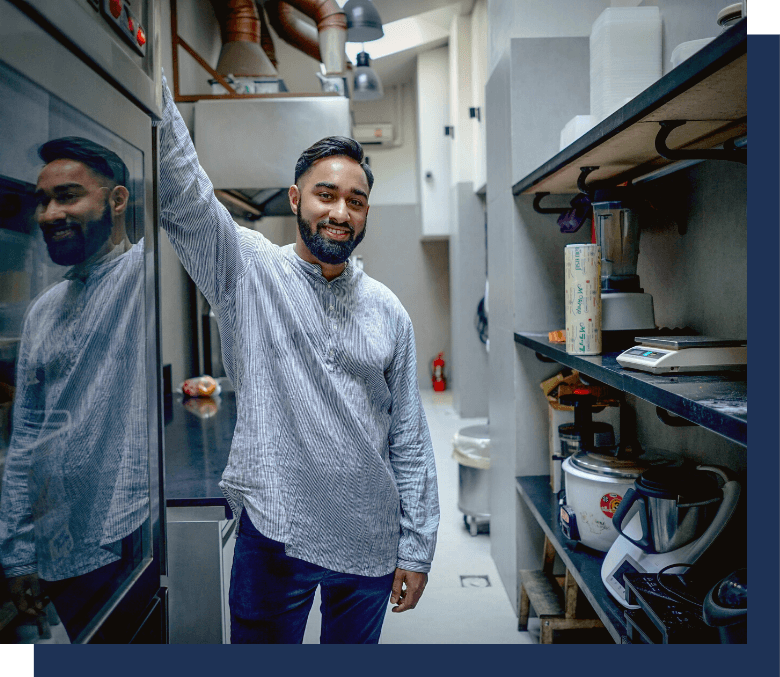 Man in back of kitchen